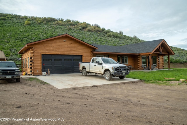 cabin featuring a garage