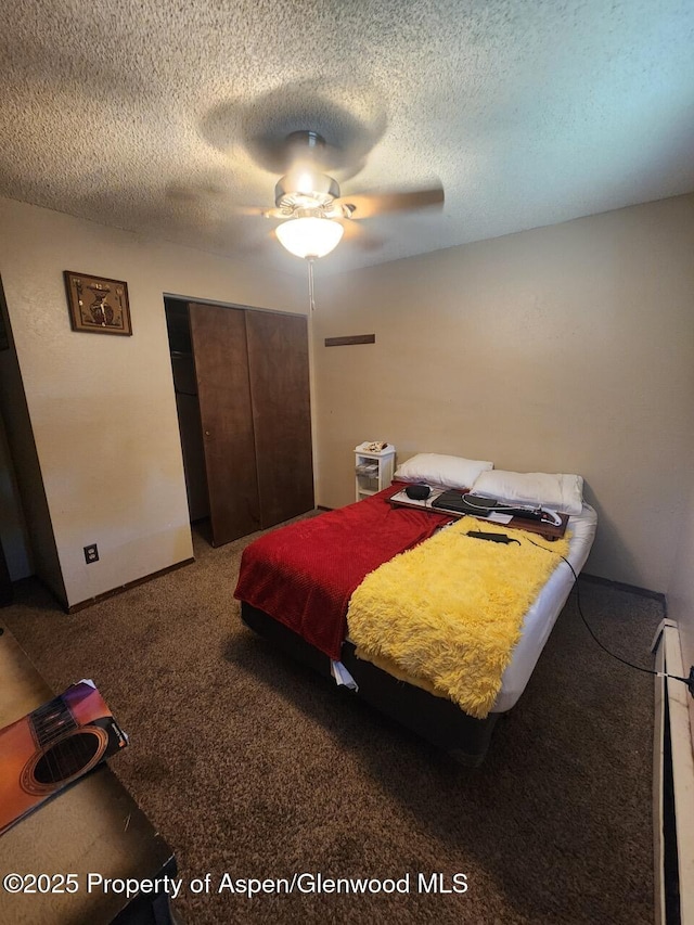 3057 Wellington Ave, Grand Junction, CO 81504 - carpeted bedroom featuring a closet, a textured ceiling, and ceiling fan
