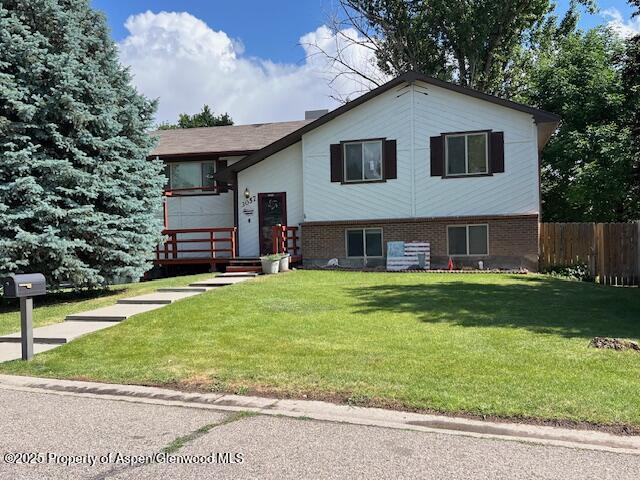 3057 Wellington Ave, Grand Junction, CO 81504 - split foyer home featuring brick siding