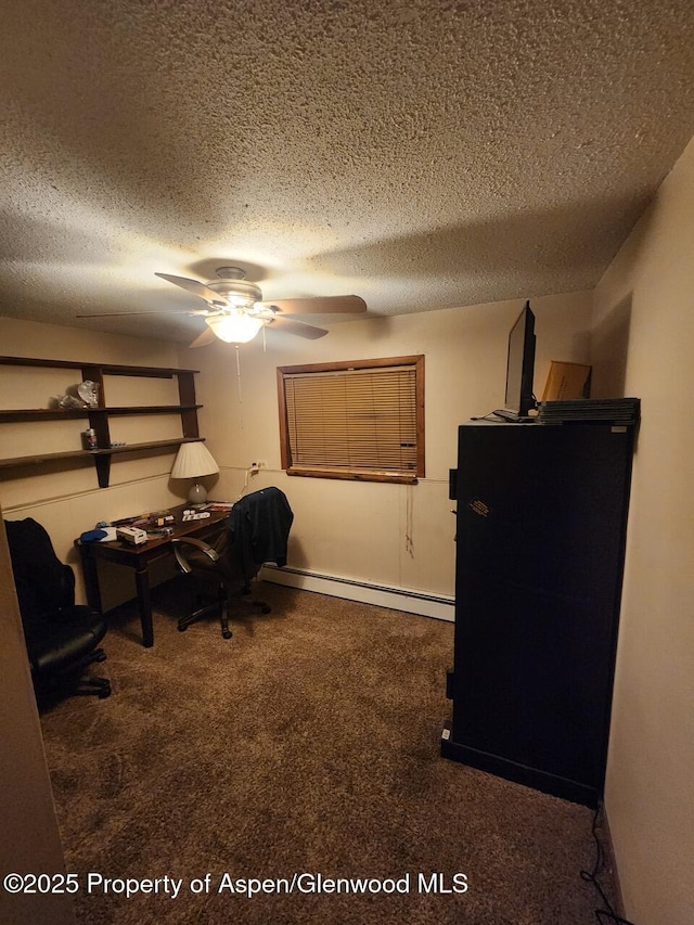 office area featuring a textured ceiling, a ceiling fan, baseboard heating, and carpet floors
