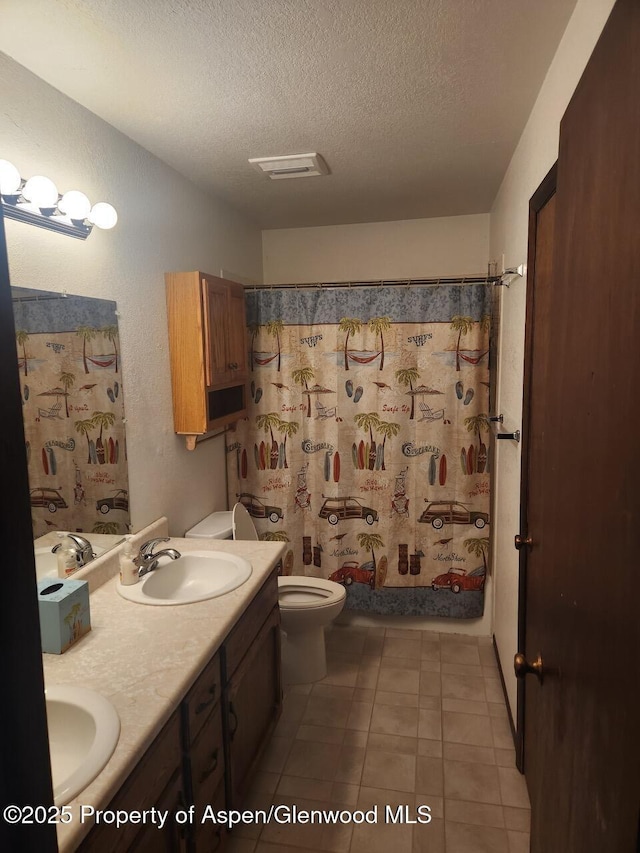 3057 Wellington Ave, Grand Junction, CO 81504 - full bath featuring a textured ceiling, double vanity, and a textured wall