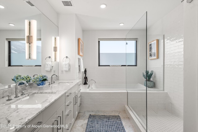 bathroom featuring vanity and plus walk in shower