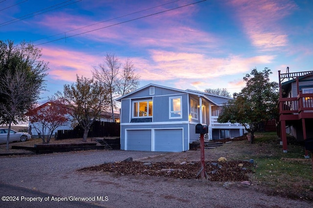 property exterior at dusk with a garage