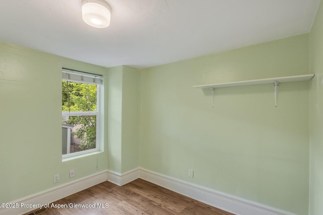 727 Bennett Ave, Glenwood Springs, CO 81601 - empty room with wood finished floors and baseboards