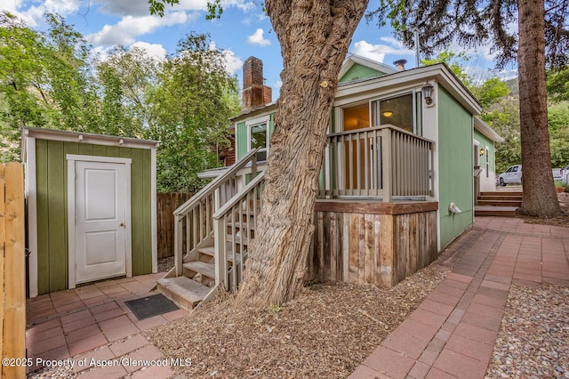 727 Bennett Ave, Glenwood Springs, CO 81601 - doorway to property with a chimney and a patio