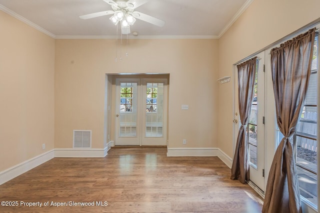 727 Bennett Ave, Glenwood Springs, CO 81601 - empty room featuring wood finished floors, a ceiling fan, and crown molding