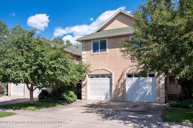 1199 Vitos Way, Carbondale, CO 81623 - view of front of property with stucco siding, a garage, and driveway