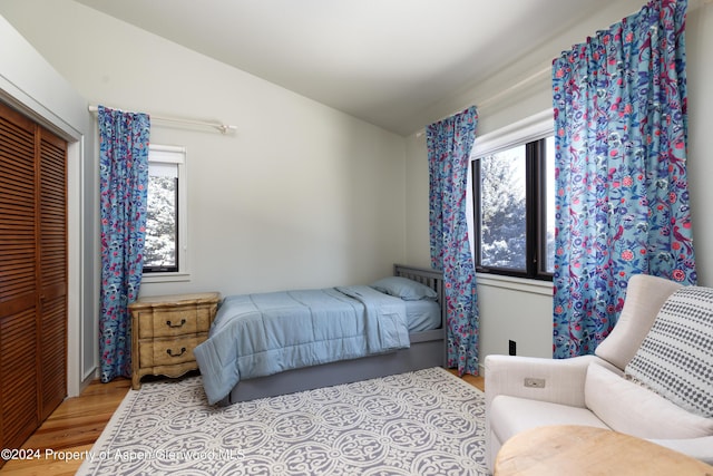 bedroom featuring light hardwood / wood-style floors and a closet