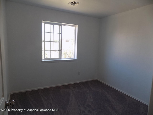 33 Angelica Cir, Parachute, CO 81635 - unfurnished room featuring dark colored carpet and baseboards