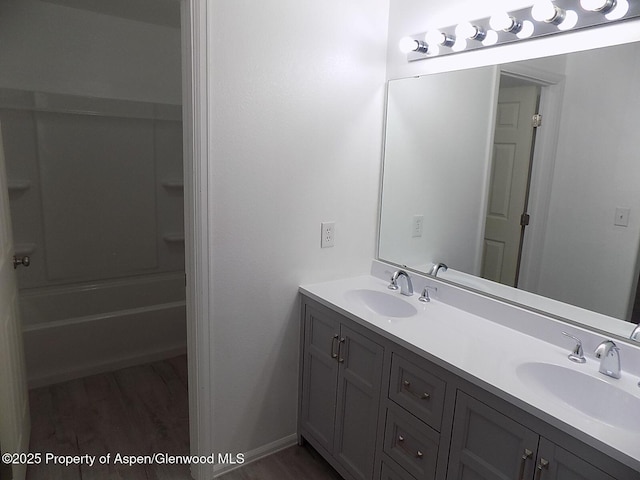 33 Angelica Cir, Parachute, CO 81635 - bathroom with double vanity, wood finished floors, and shower / washtub combination