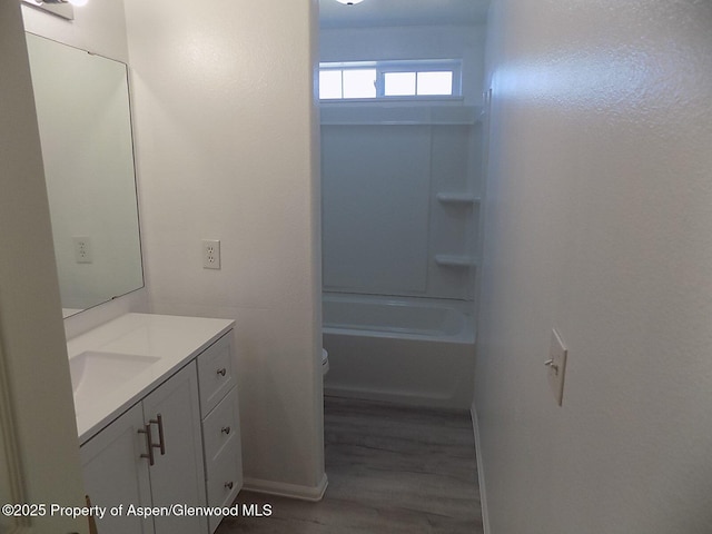 33 Angelica Cir, Parachute, CO 81635 - full bath featuring vanity, wood finished floors, and bathtub / shower combination