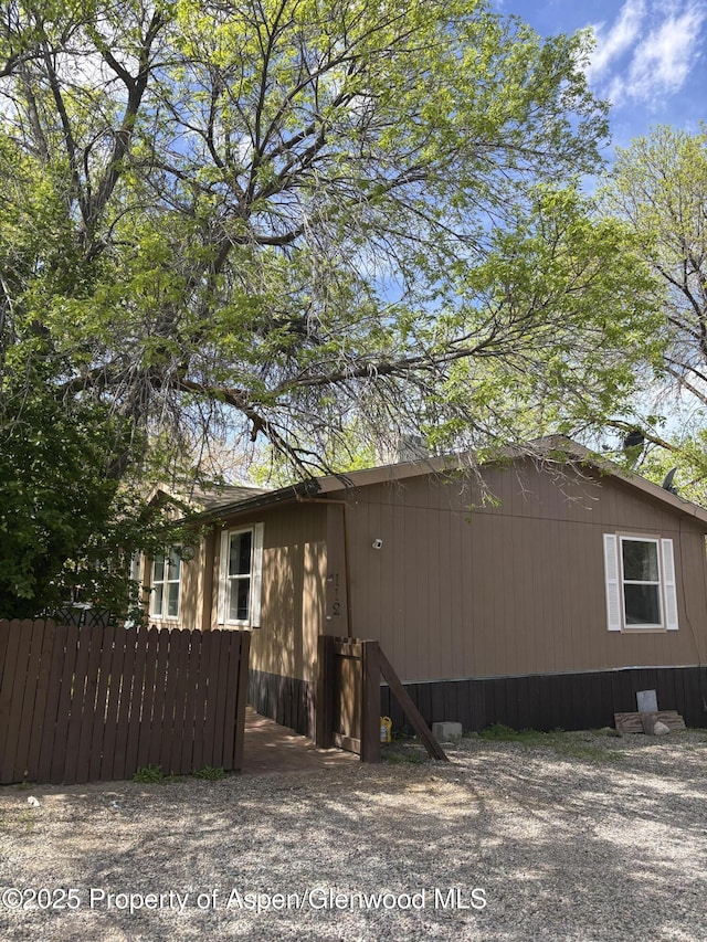 5033 County Road 335 Unit 112, New Castle, CO 81647 - view of home's exterior with fence