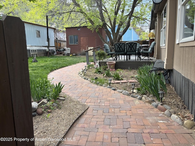 5033 County Road 335 Unit 112, New Castle, CO 81647 - view of yard with a patio area and fence