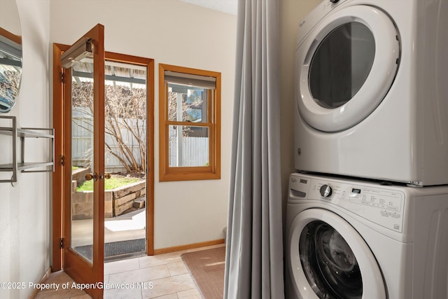 534/536 Spruce St, Aspen, CO 81611 - laundry area featuring stacked washer / drying machine, healthy amount of natural light, and light tile patterned floors