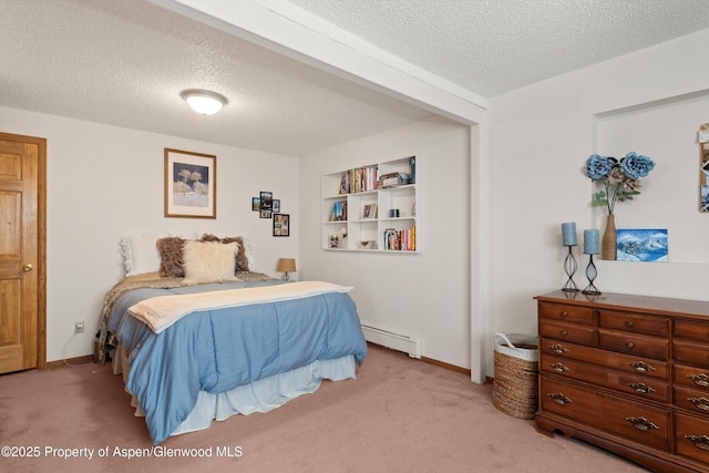534/536 Spruce St, Aspen, CO 81611 - bedroom with a textured ceiling, carpet, and a baseboard heating unit