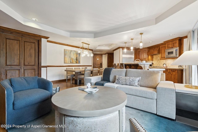 living room featuring a tray ceiling