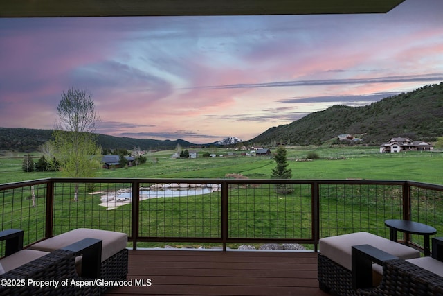 103 Ranch Ln, Glenwood Springs, CO 81601 - wooden deck featuring a mountain view, a view of countryside, and a lawn