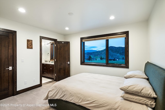 103 Ranch Ln, Glenwood Springs, CO 81601 - bedroom with light carpet, baseboards, recessed lighting, and connected bathroom