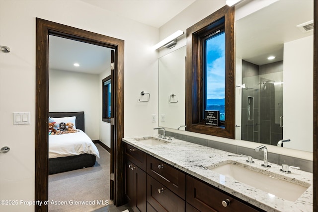 103 Ranch Ln, Glenwood Springs, CO 81601 - ensuite bathroom with a shower stall, double vanity, and recessed lighting