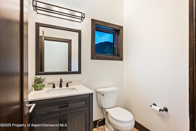 103 Ranch Ln, Glenwood Springs, CO 81601 - half bath featuring toilet, vanity, and baseboards