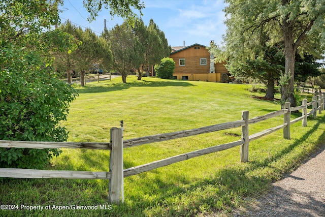 view of yard with a rural view