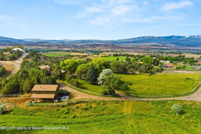 drone / aerial view with a mountain view and a rural view