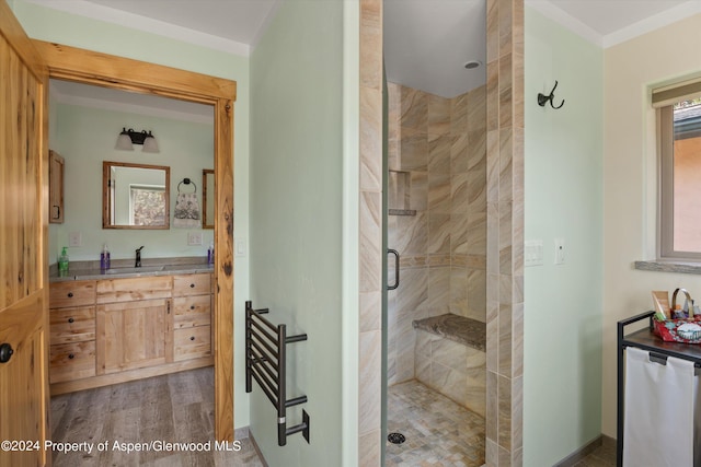 bathroom featuring hardwood / wood-style floors, vanity, and an enclosed shower