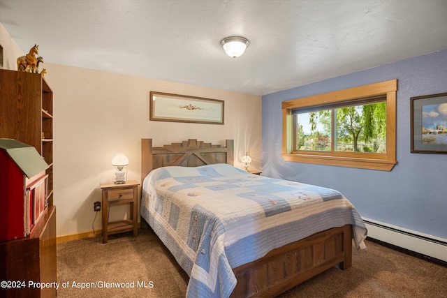 carpeted bedroom with baseboard heating