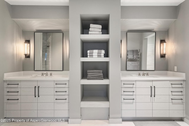 bathroom featuring vanity and built in shelves