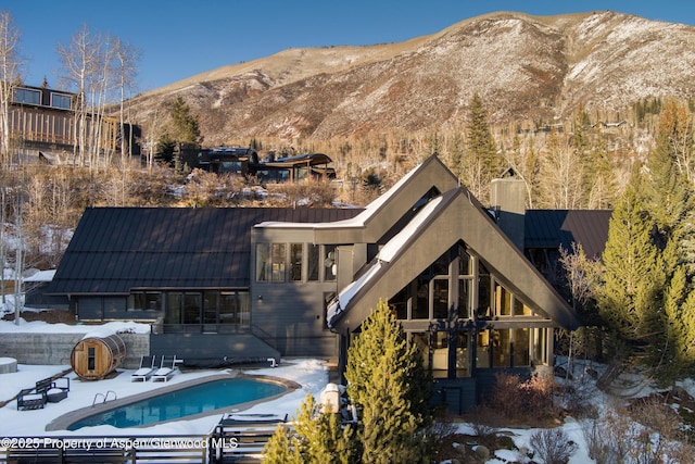 back of house featuring a mountain view