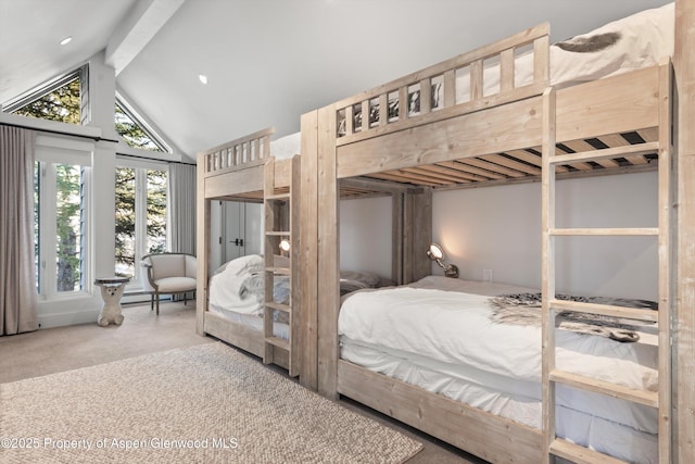 bedroom featuring lofted ceiling with beams, a baseboard radiator, and carpet flooring