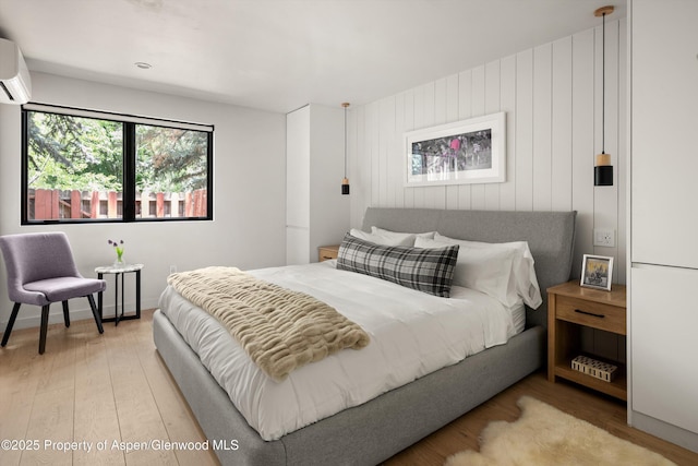 373 Sopris Creek Rd Unit 6, Basalt, CO 81621 - bedroom with wood finished floors and a wall unit AC