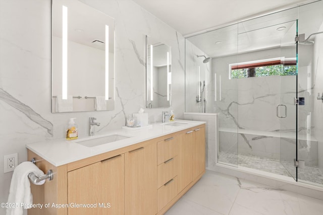 373 Sopris Creek Rd Unit 6, Basalt, CO 81621 - bathroom with marble look tile flooring, a marble finish shower, and double vanity