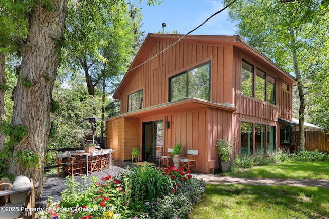 373 Sopris Creek Rd Unit 6, Basalt, CO 81621 - rear view of house with board and batten siding and outdoor dining area