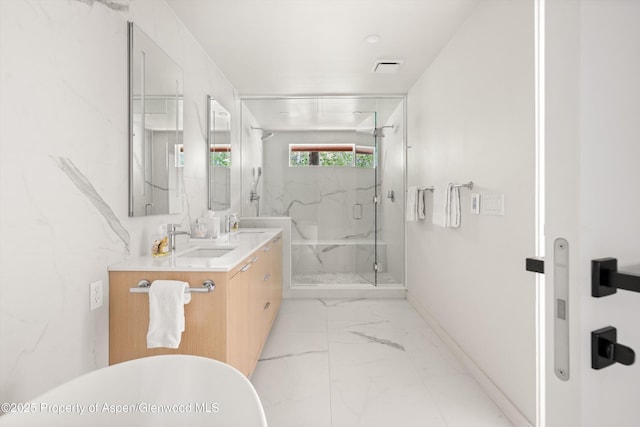 373 Sopris Creek Rd Unit 6, Basalt, CO 81621 - bathroom featuring double vanity, marble finish floors, a marble finish shower, and a freestanding tub