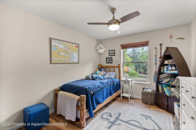 4122 Sky Ranch Dr, Glenwood Springs, CO 81601 - bedroom with wood finished floors, baseboards, and a ceiling fan