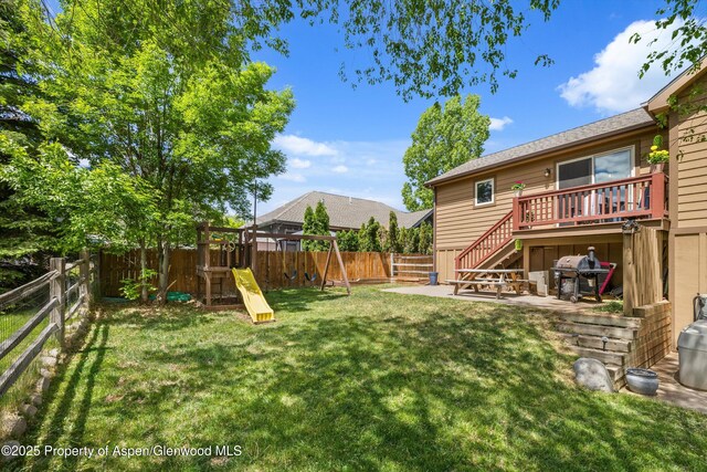 4122 Sky Ranch Dr, Glenwood Springs, CO 81601 - view of yard with a playground, stairs, a patio area, and a wooden deck