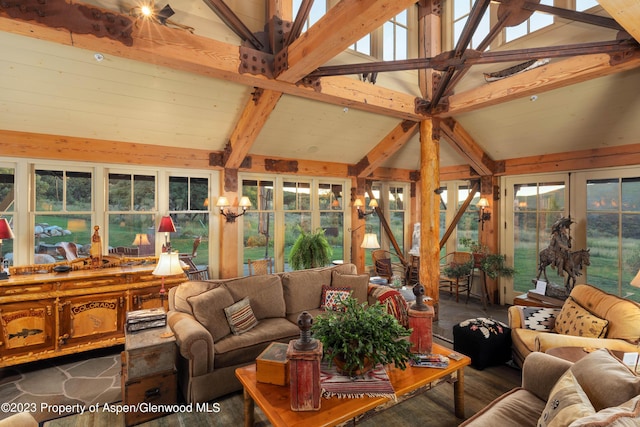 sunroom with vaulted ceiling with beams and french doors