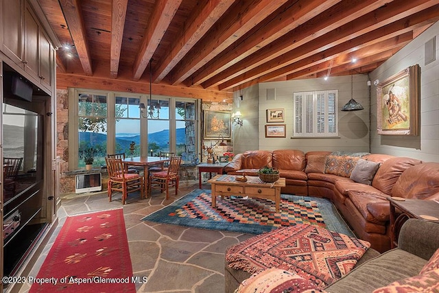 living room with a mountain view and an inviting chandelier