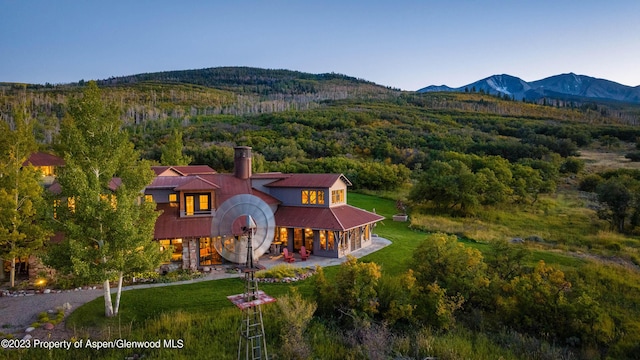 drone / aerial view featuring a mountain view