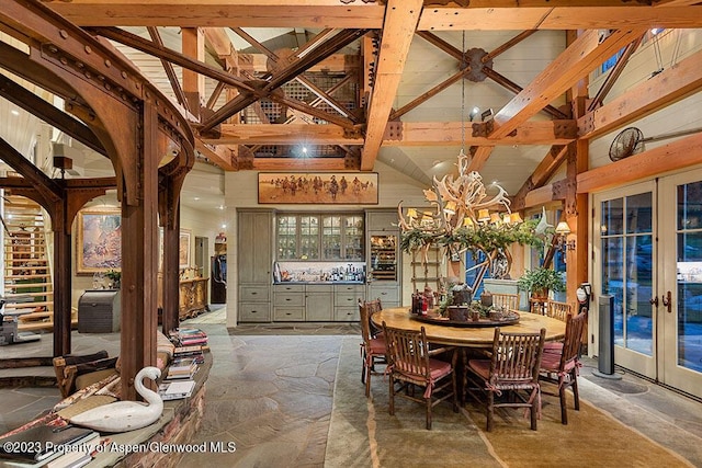 dining room with beam ceiling, french doors, and high vaulted ceiling