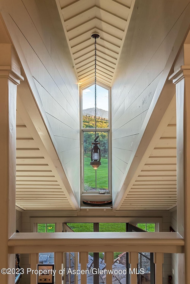 interior details featuring a mountain view and wood walls