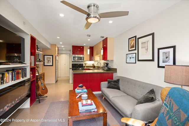 living room featuring ceiling fan and sink