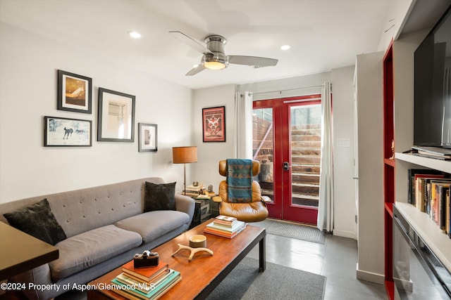 living room featuring ceiling fan and french doors