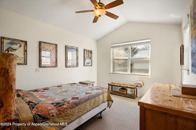 bedroom with vaulted ceiling, ceiling fan, and carpet flooring