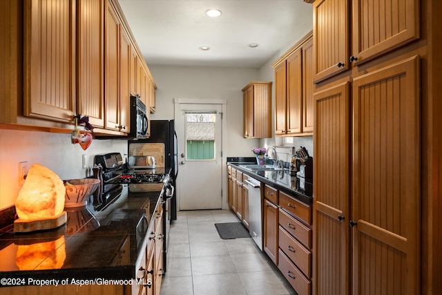 kitchen featuring sink and black appliances