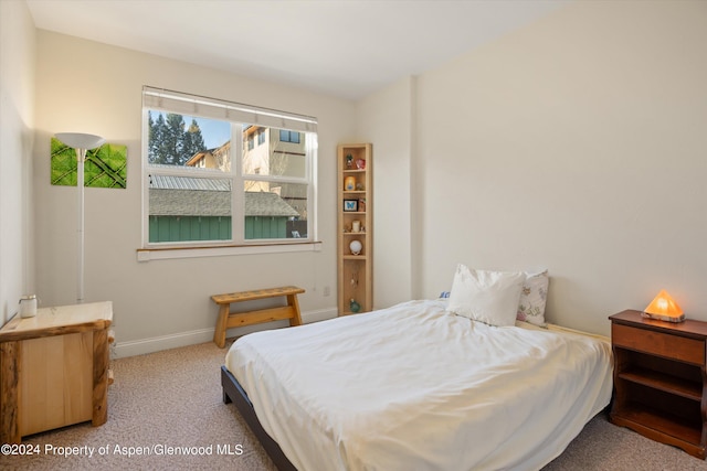 bedroom with light carpet