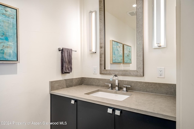 bathroom with visible vents and vanity