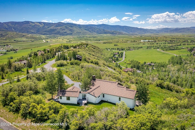 birds eye view of property with a rural view and a mountain view