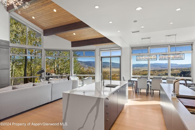 36125 Quarry Ridge Rd, Steamboat, CO 80487 - kitchen featuring modern cabinets, a mountain view, a chandelier, light wood-style flooring, and recessed lighting